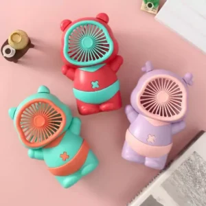 desktop mini fan placed on office desk for cooling